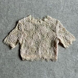 A. Peach cream lace top